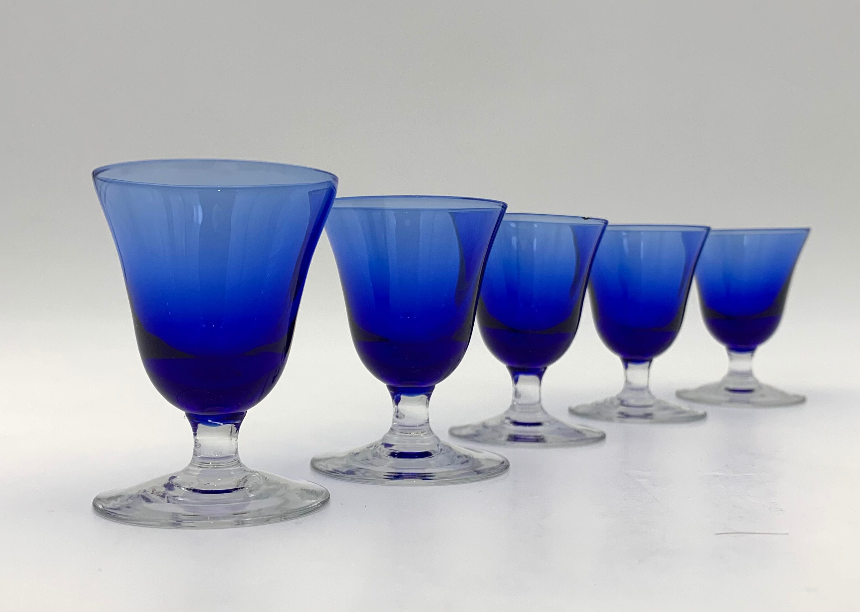 Nine vintage liquor glasses, coloured glass 20th century