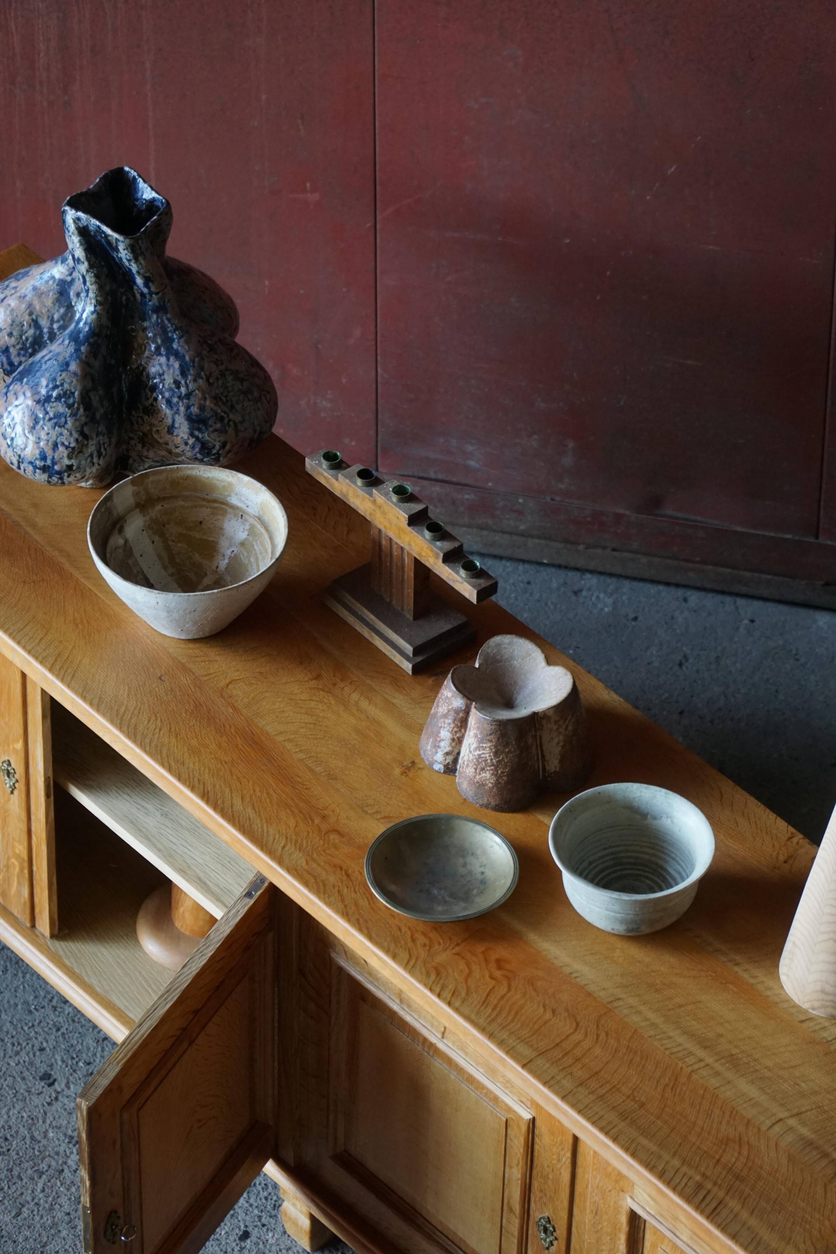 Modern Danish low enfilade in oak with panelled doors, mid-20th century.