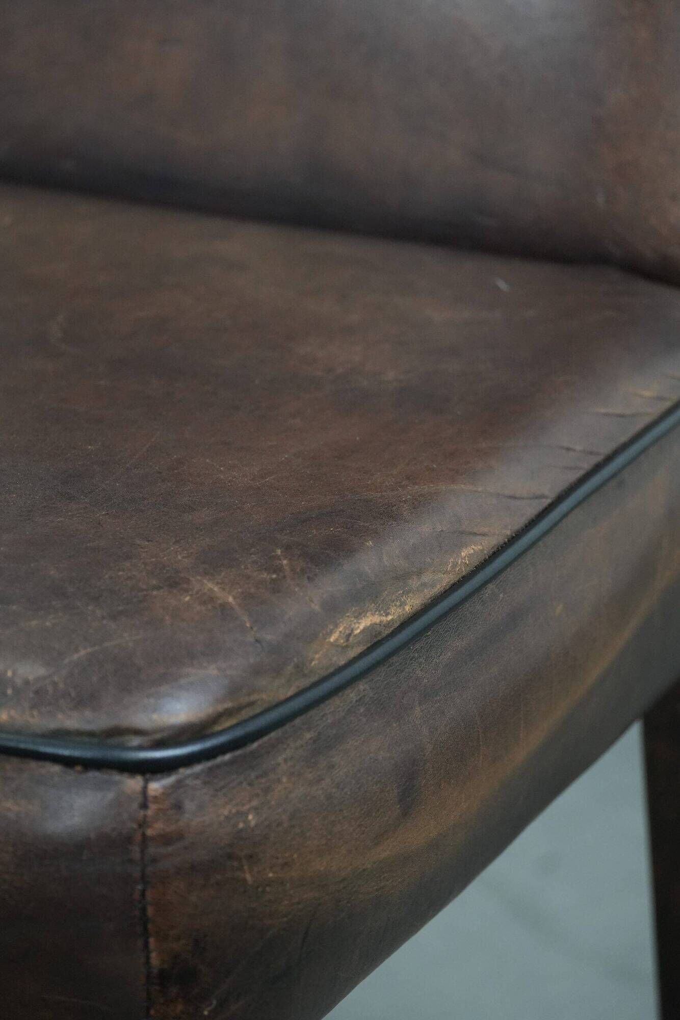 Set of 6 vintage sheepskin dining chairs finished with black piping