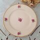 7 mismatched antique dessert plates accompanied by a pie dish