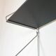 Mid-century vintage shelf in a loop shape, black glass and metal.
