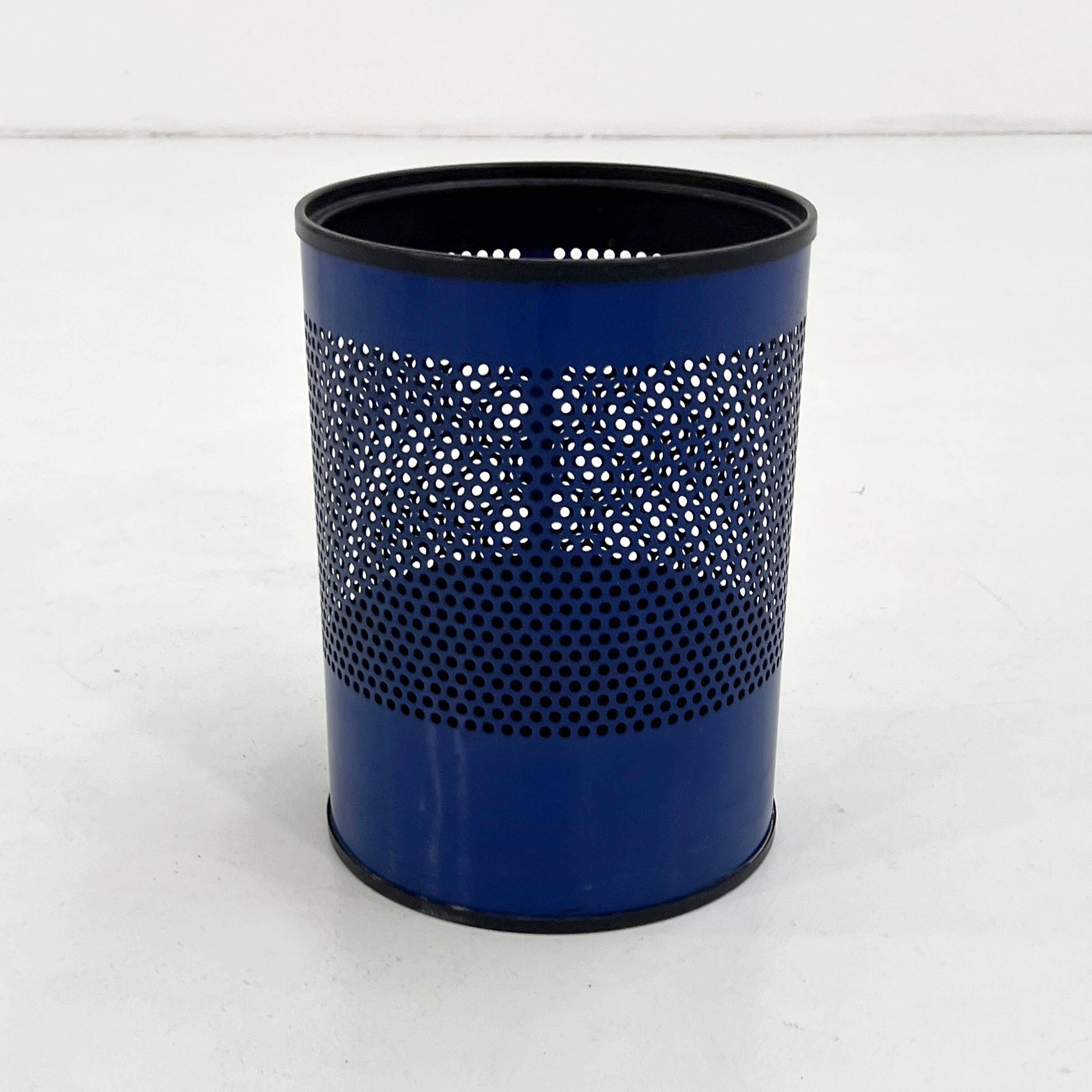 Blue perforated metal bin, 1980