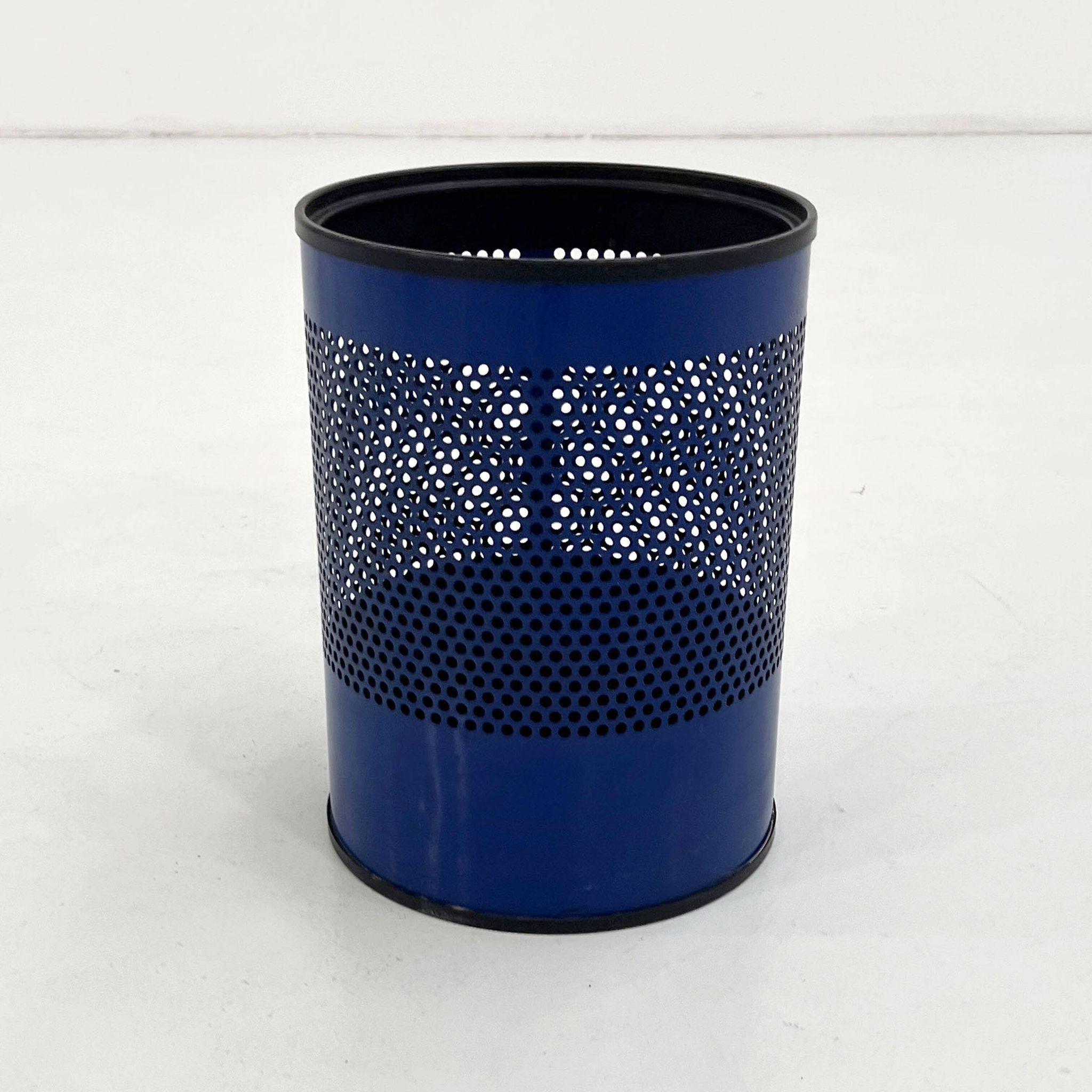 Blue perforated metal bin, 1980