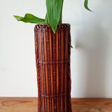 Japanese vase made of woven bamboo. Ikebana