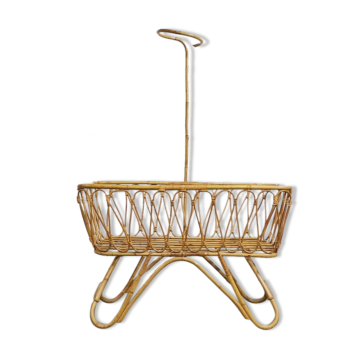 Baby cradle in vintage rattan