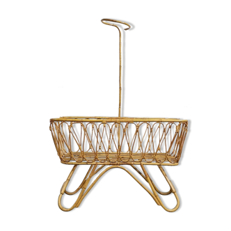Baby cradle in vintage rattan