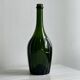 Translucent green glass bottle, classic design.