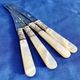 4 antique butter spreading knives in silver-plated metal and mother-of-pearl.