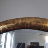 Oval mirror with gold leaf
