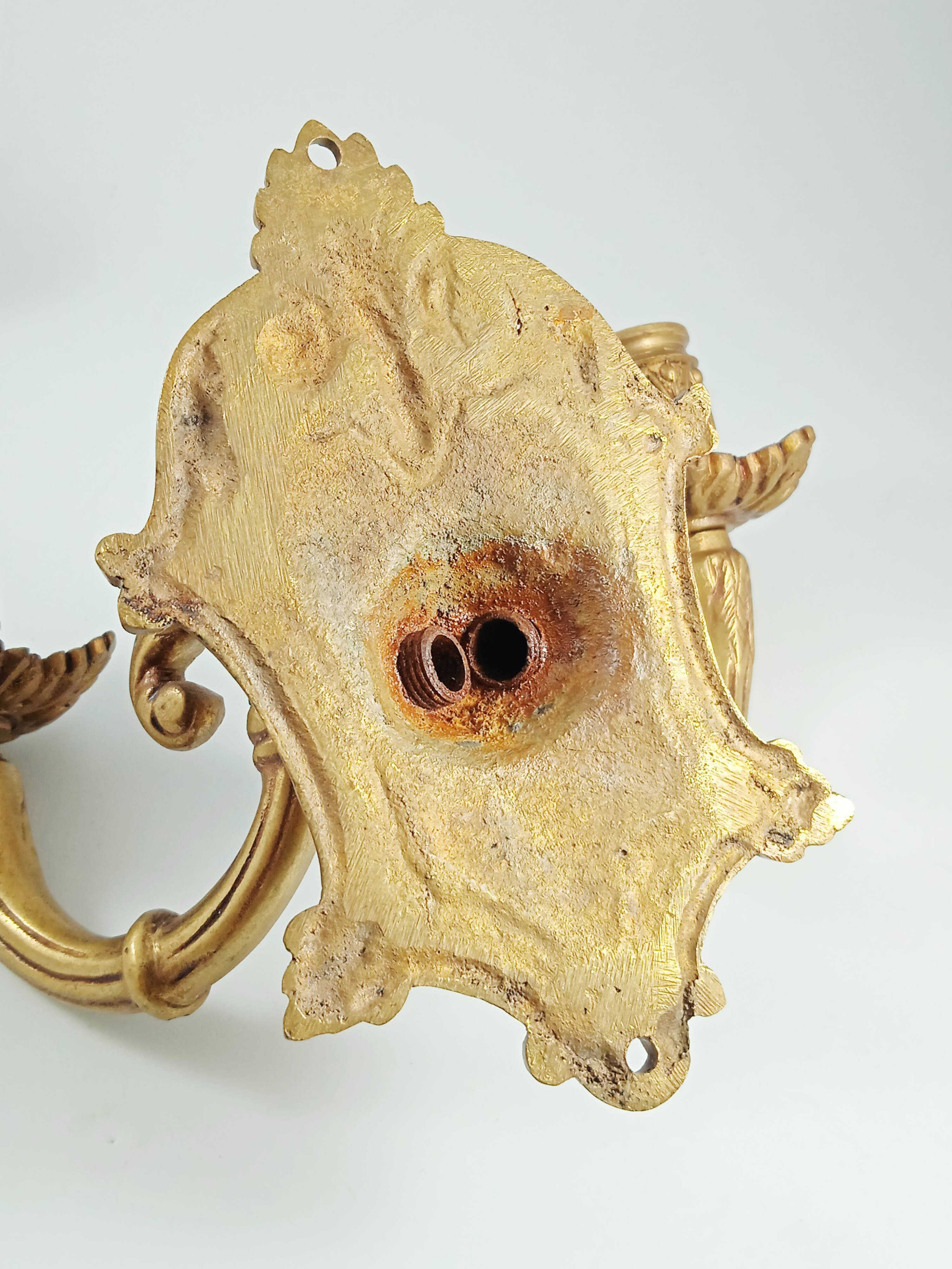 Set of 2 old candlestick sconces in bronze
