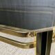 Table basse vintage années 70 en métal doré et verre fumé