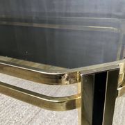Vintage 1970s coffee table in gold metal and smoked glass.