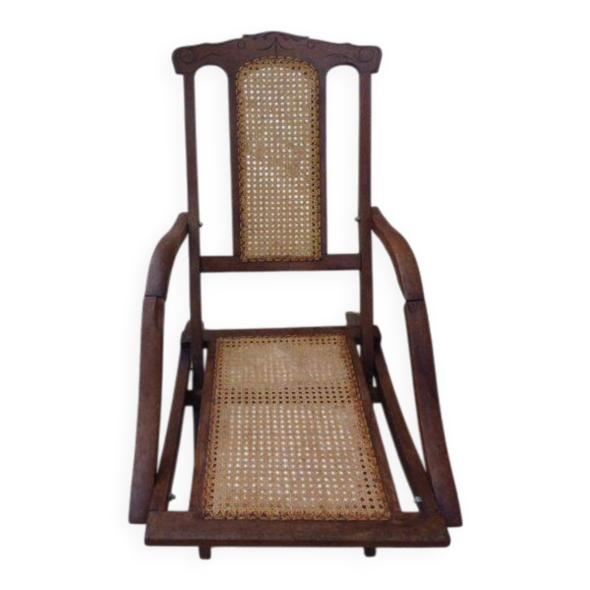 Antique folding chair with caned seat and backrest made of wood.