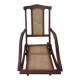Antique folding chair with caned seat and backrest made of wood.