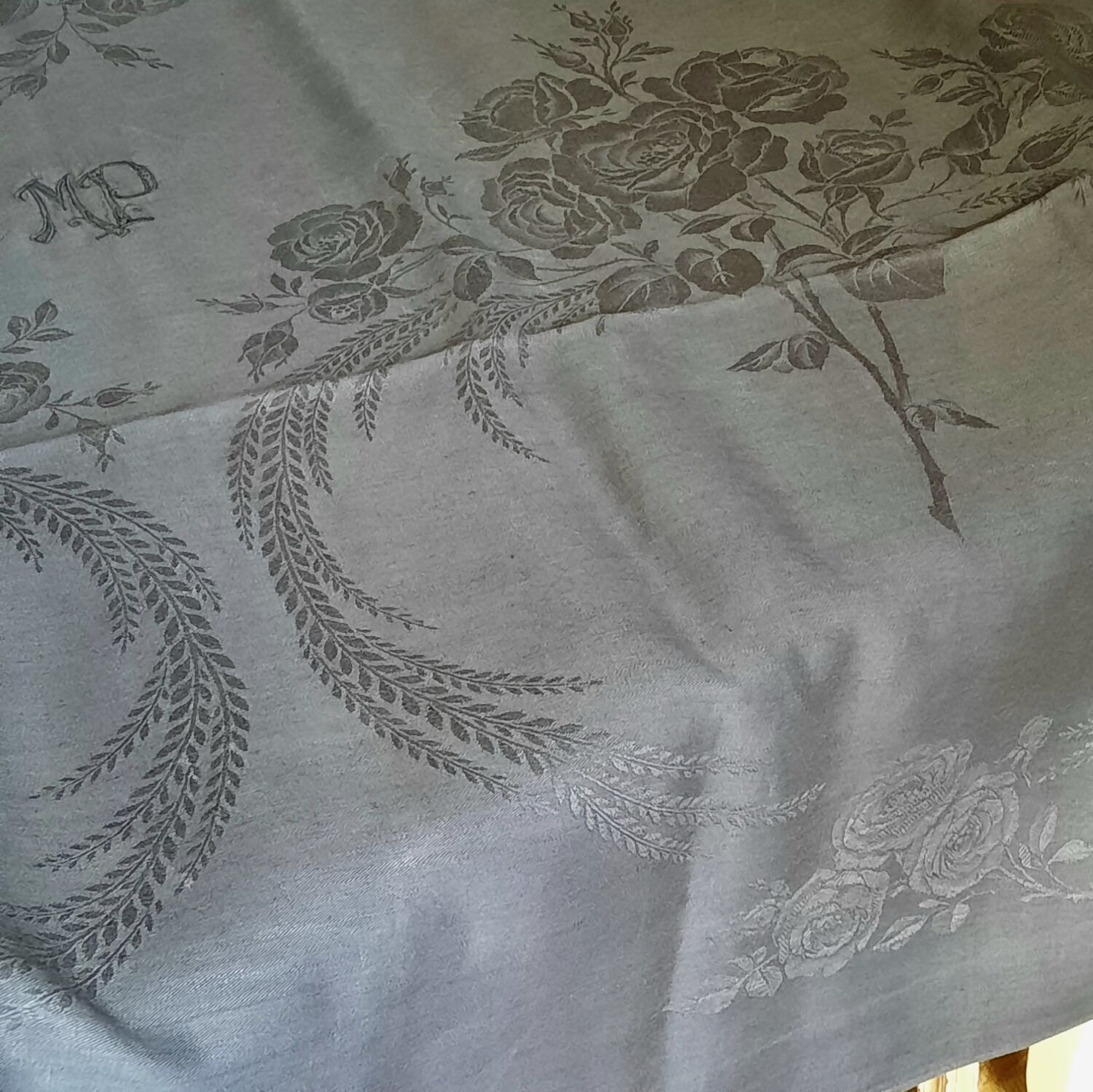 Old damask tablecloth with monogram