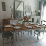 Farmhouse table with pearl gray base and raw wood top.
