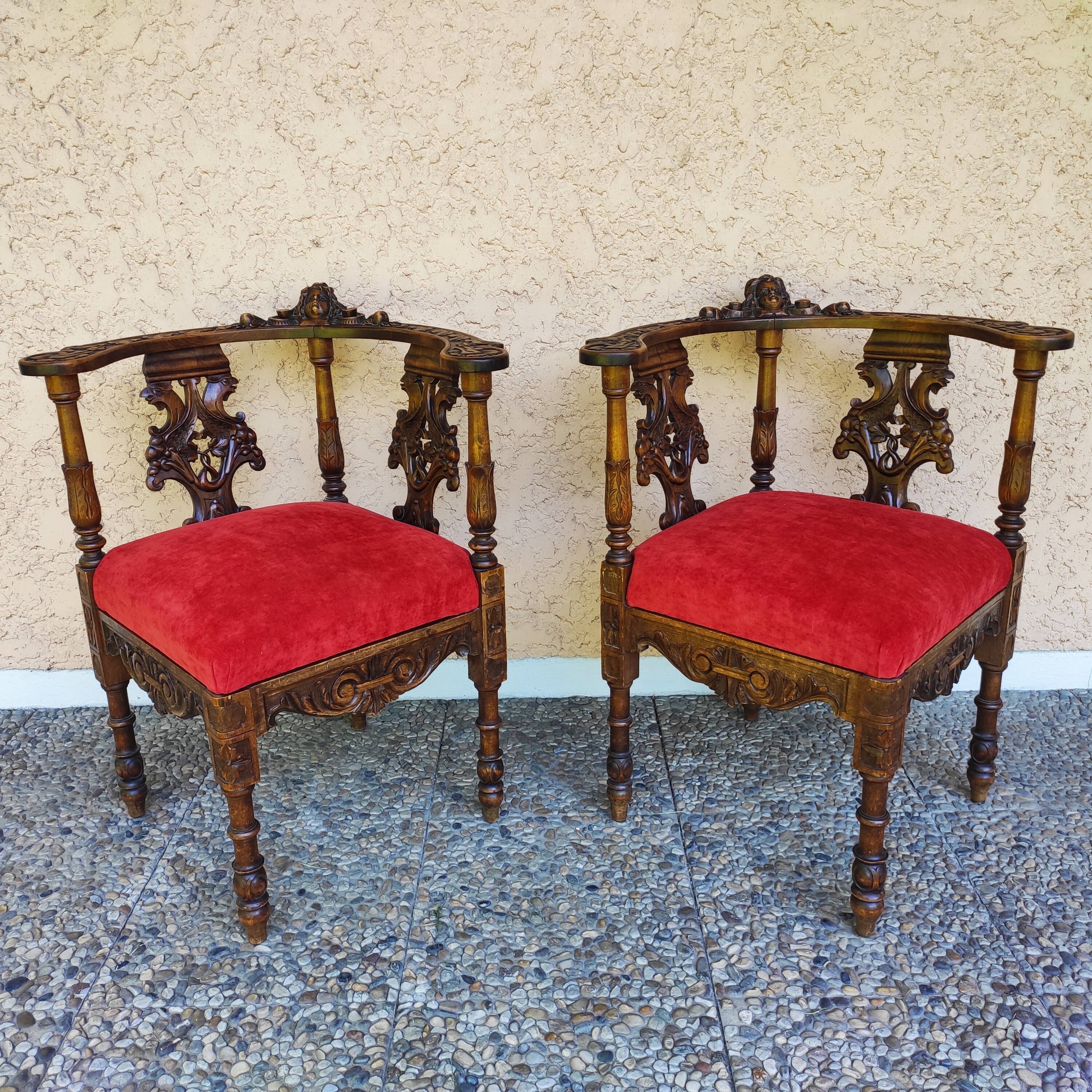 Pair of neo-Renaissance Henri II corner armchairs in carved wood, 19th century.