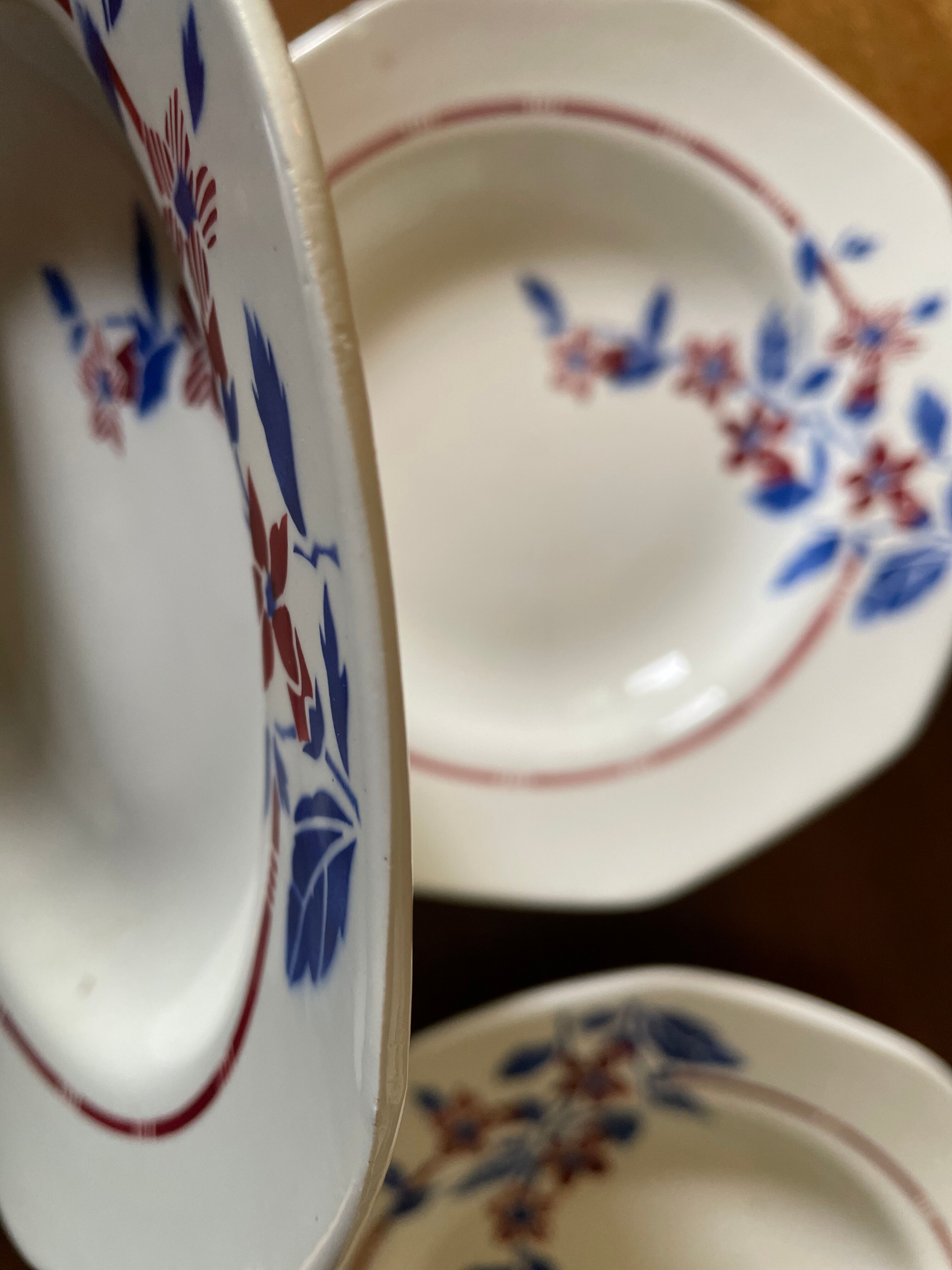 Saint Amand hollow plates decorated with red and blue flowers