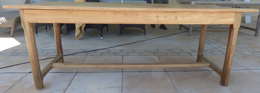 Large honey-colored farmhouse table in solid oak