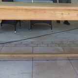 Large honey-colored farmhouse table in solid oak