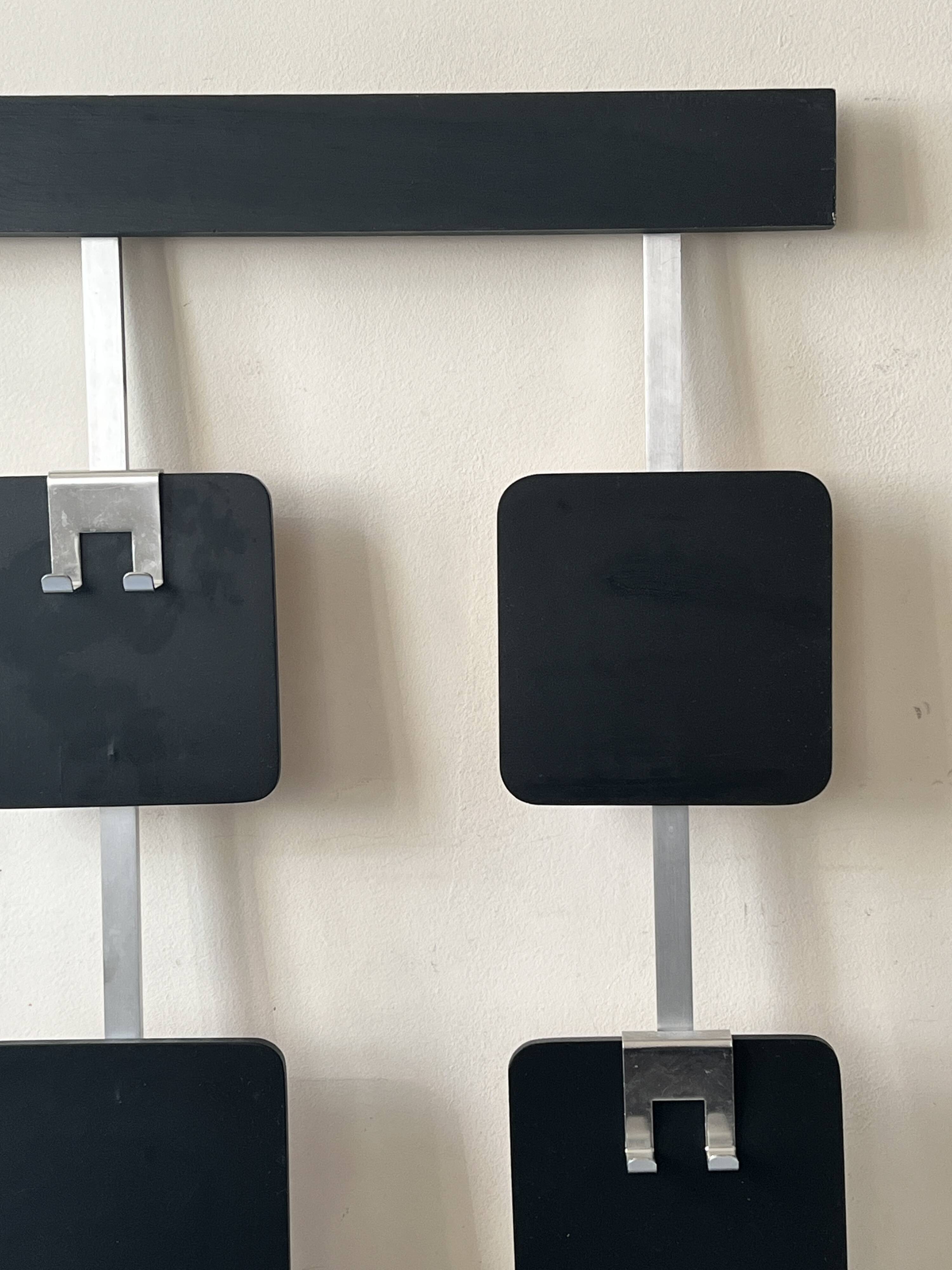 Large modernist wall coat rack in wood and metal, 1970s design.