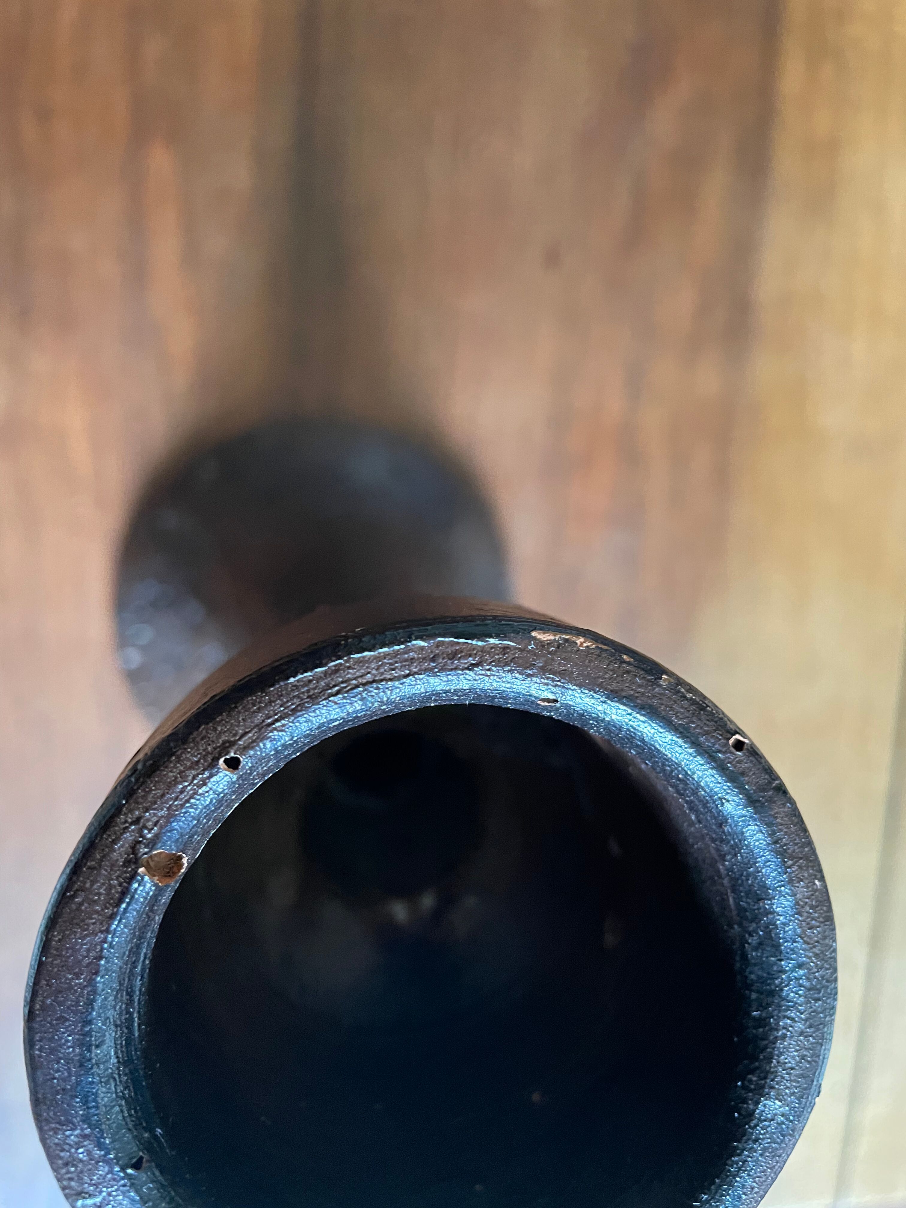 Brown enamelled terracotta candle holder