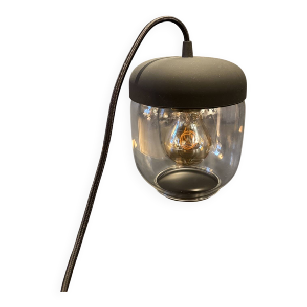 Lampe baladeuse en verre transparent et plastique noir
