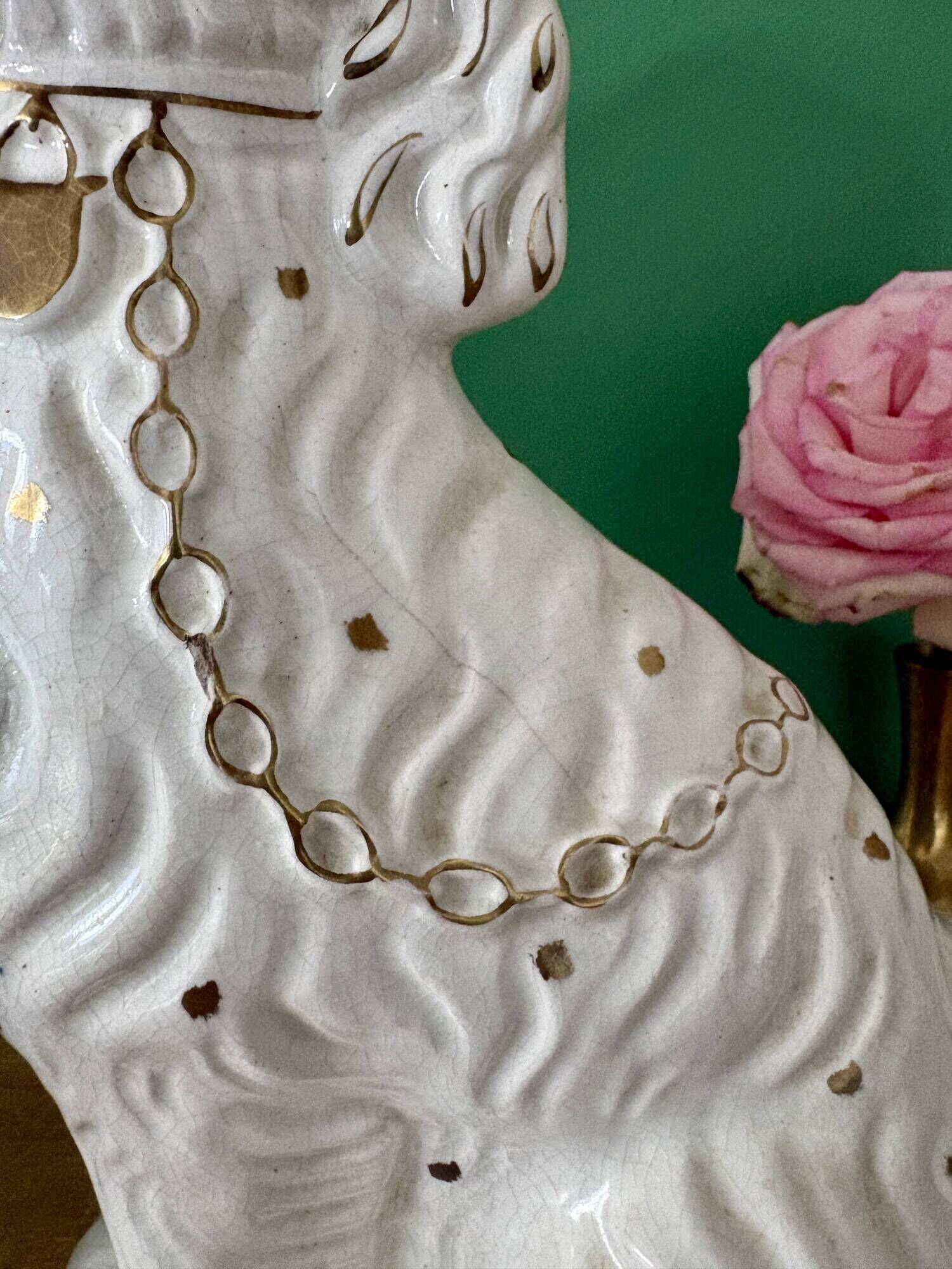 Pair of Staffordshire-type dogs in white and gold ceramic