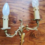 Pair of appliques with two arms of light with a leafy decoration