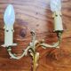 Pair of appliques with two arms of light with a leafy decoration