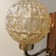 Wall light in rosewood with bobble glass ball shade.