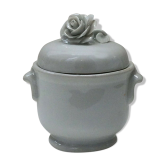 White porcelain jar on wrist