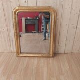 Golden Louis Philippe mirror with golden leafy