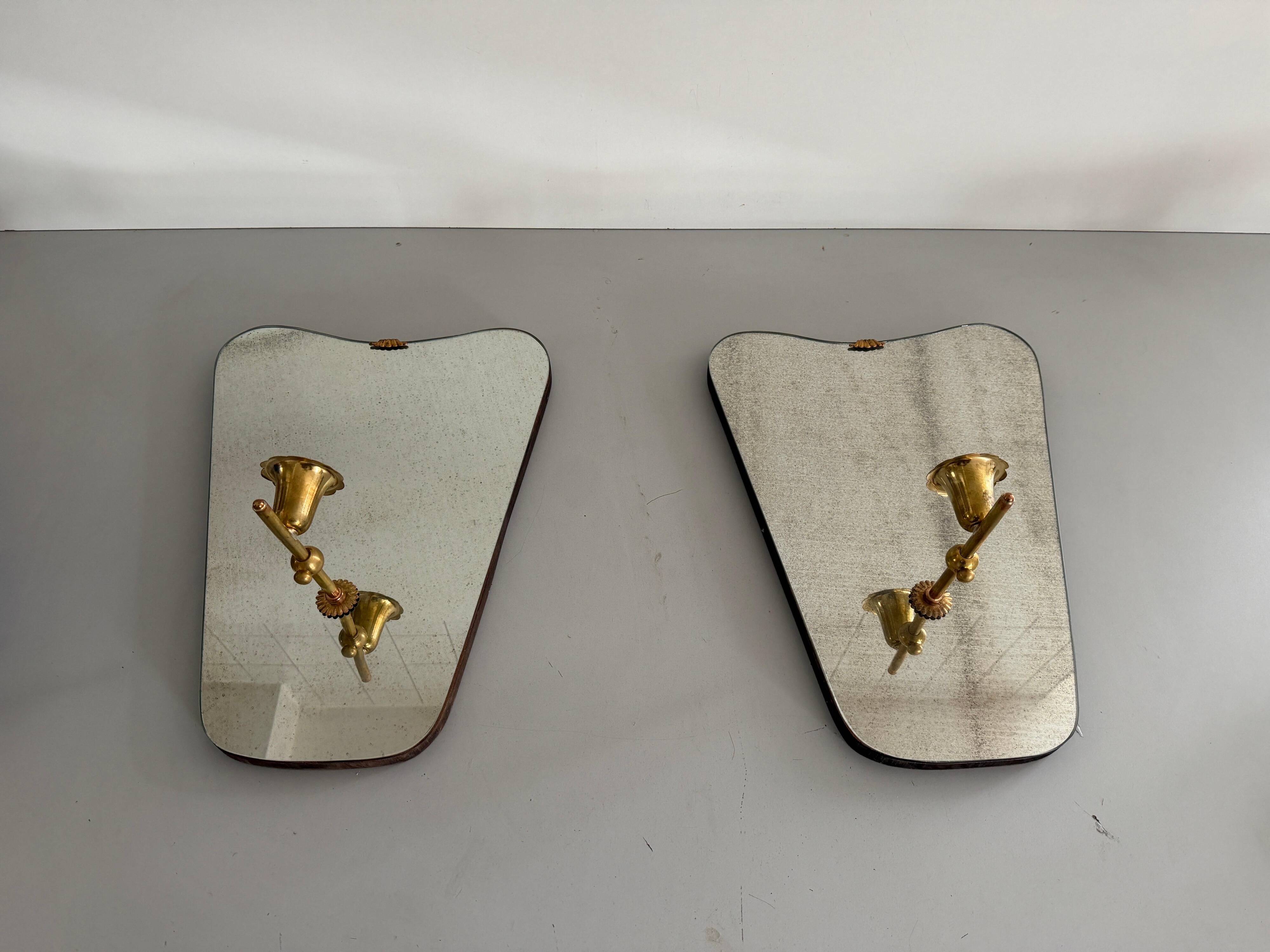 Pair of brass wall lights with mirrors, mid-20th century, Italy, 1960.