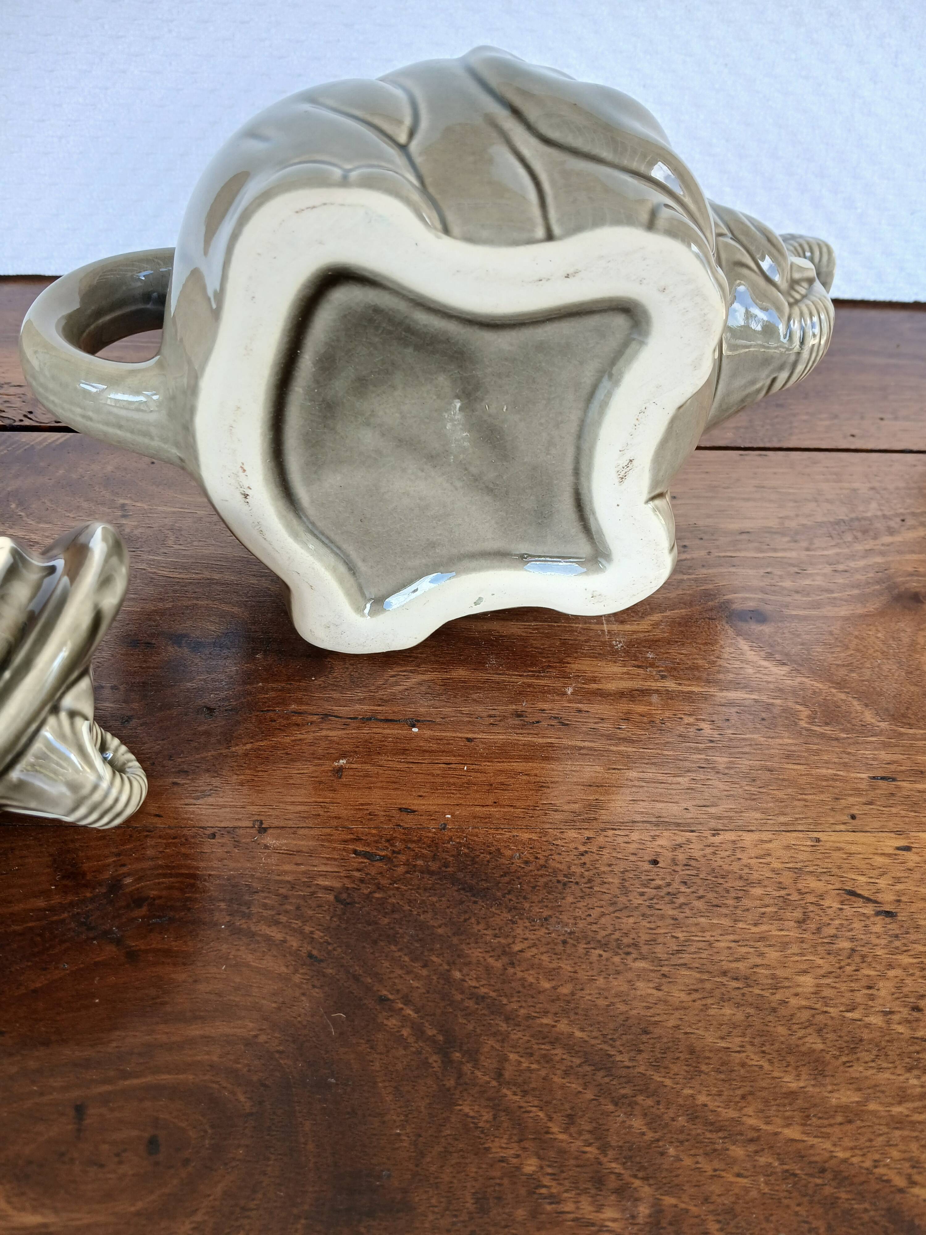 vintage ceramic teapot in the shape of a grey elephant