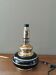 Vintage 70s lamp base in black and gold metal.