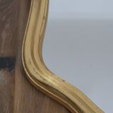 Golden mirror in wood and gold leaf