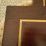 Pull-out tables in mahogany and vintage brass