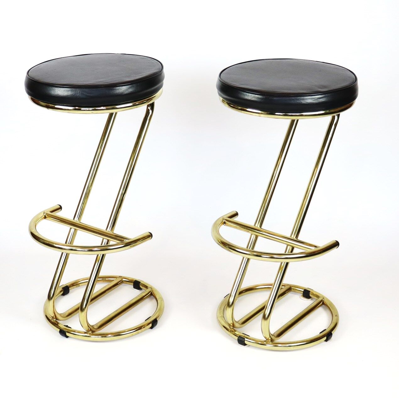 Pair of high brass stools