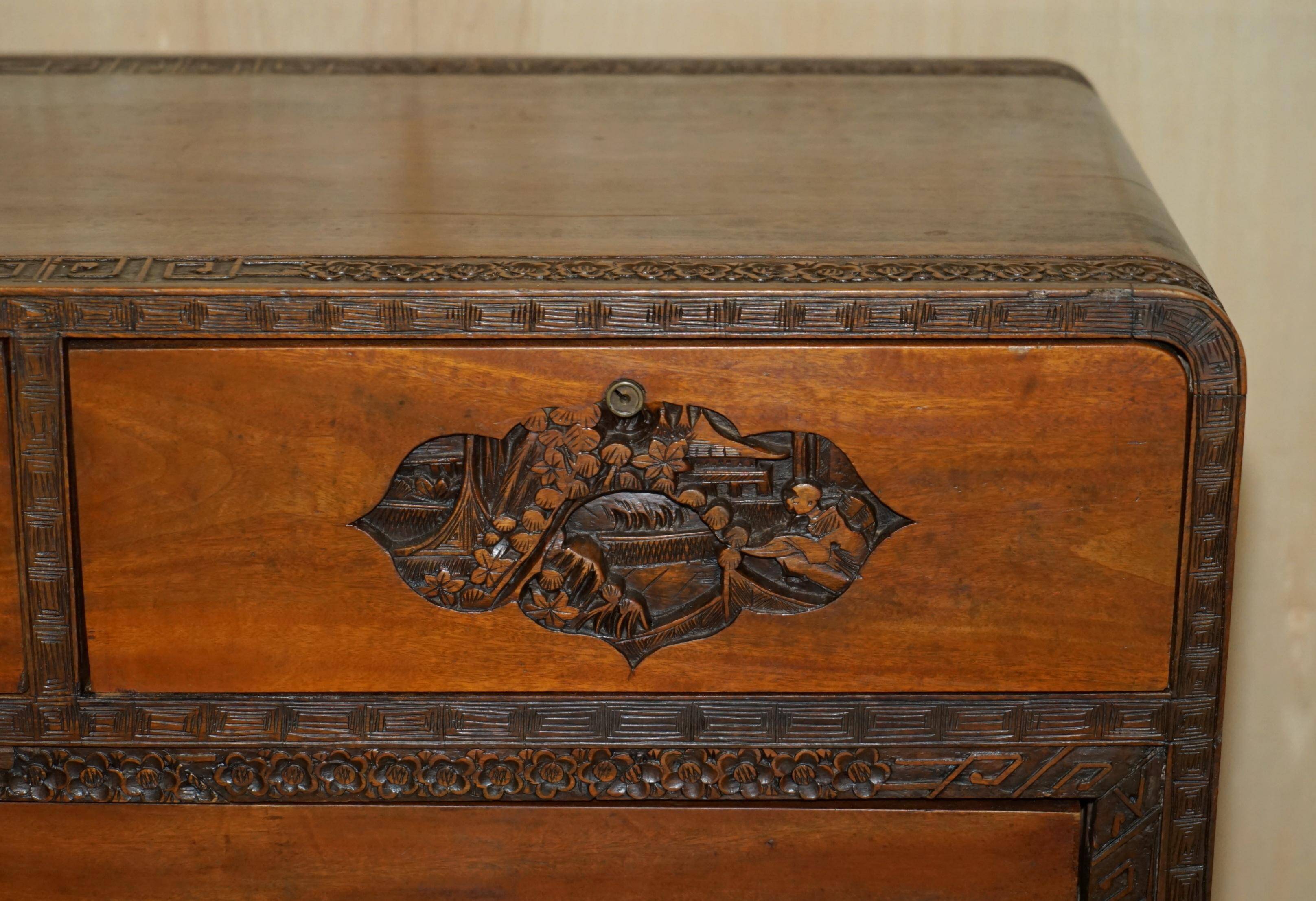 Antique Chinese commode hand-carved circa 1890 with detailed handles.