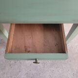 Green side table with tapered legs