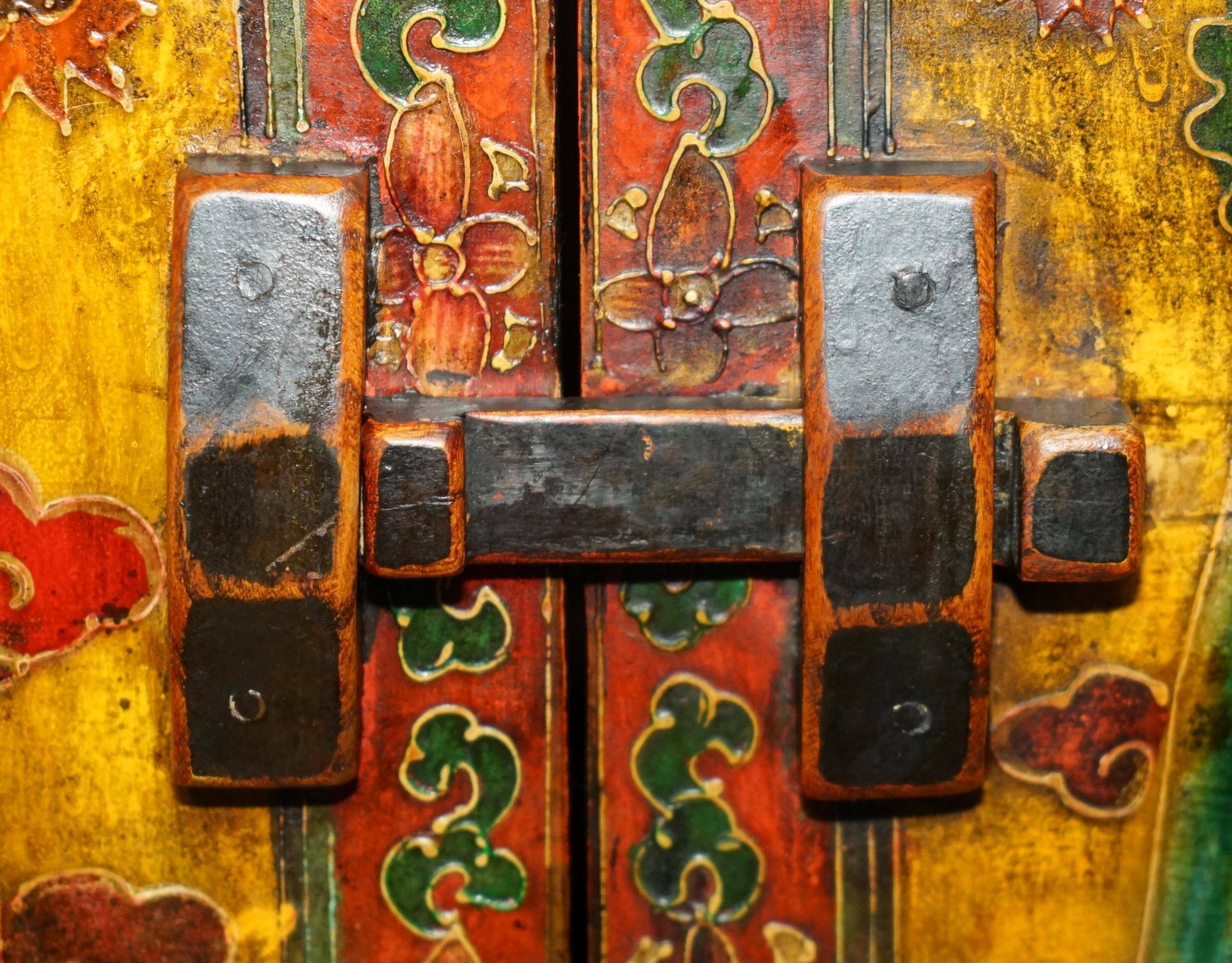 Vintage Chinese wardrobe painted with pagoda and drawers.