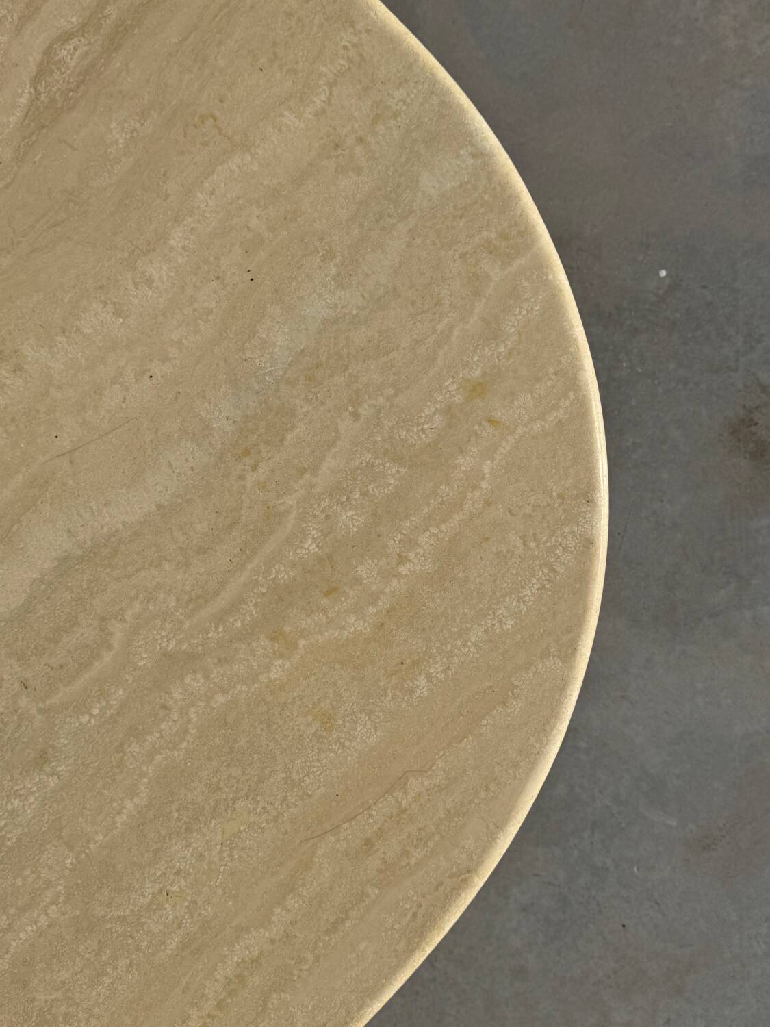 Large designer coffee table in travertine, eye shape, Roche Bobois edition from the 80s