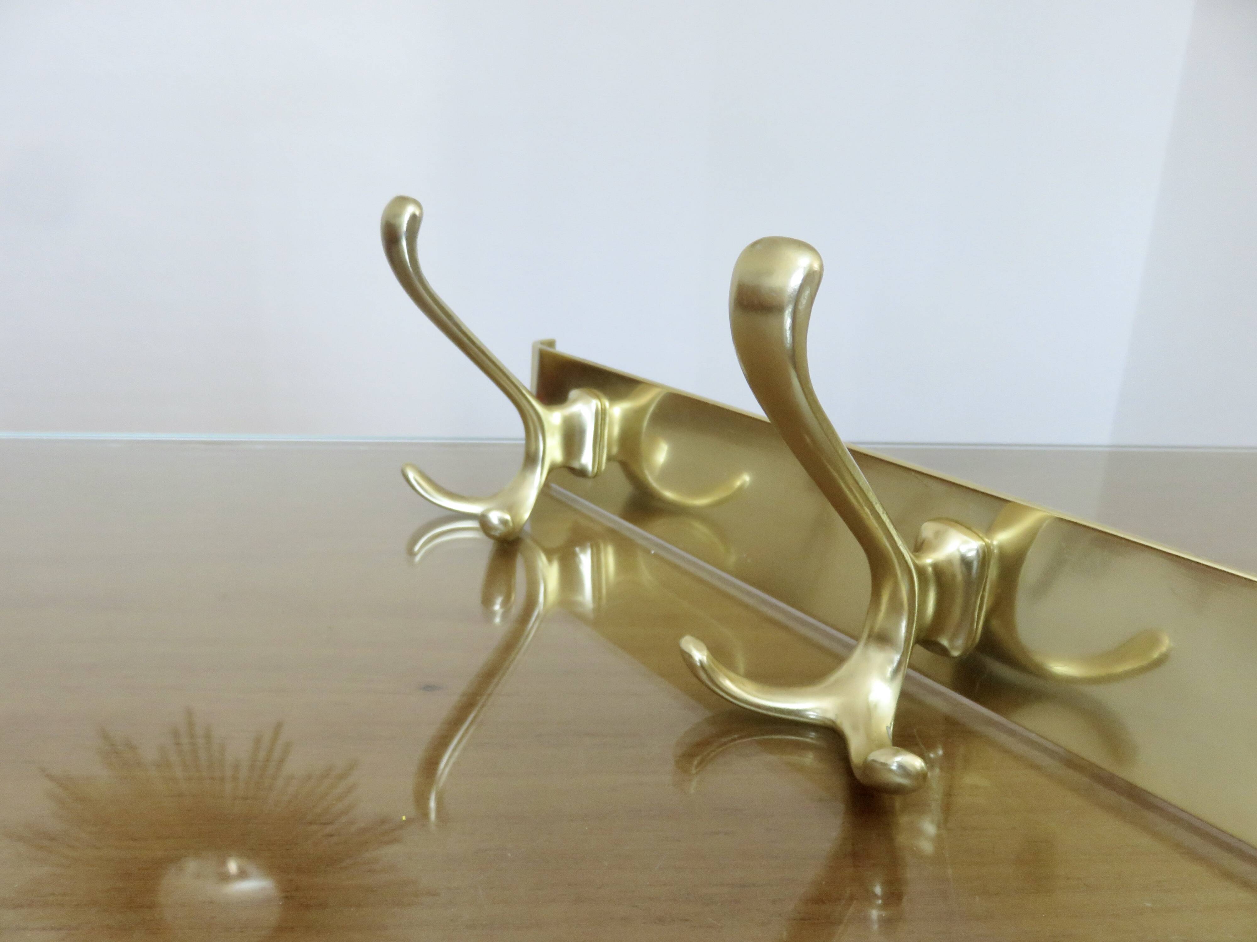 Large wall-mounted coat rack in gold aluminum, 60s-70s