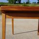 Extendable table, compass legs