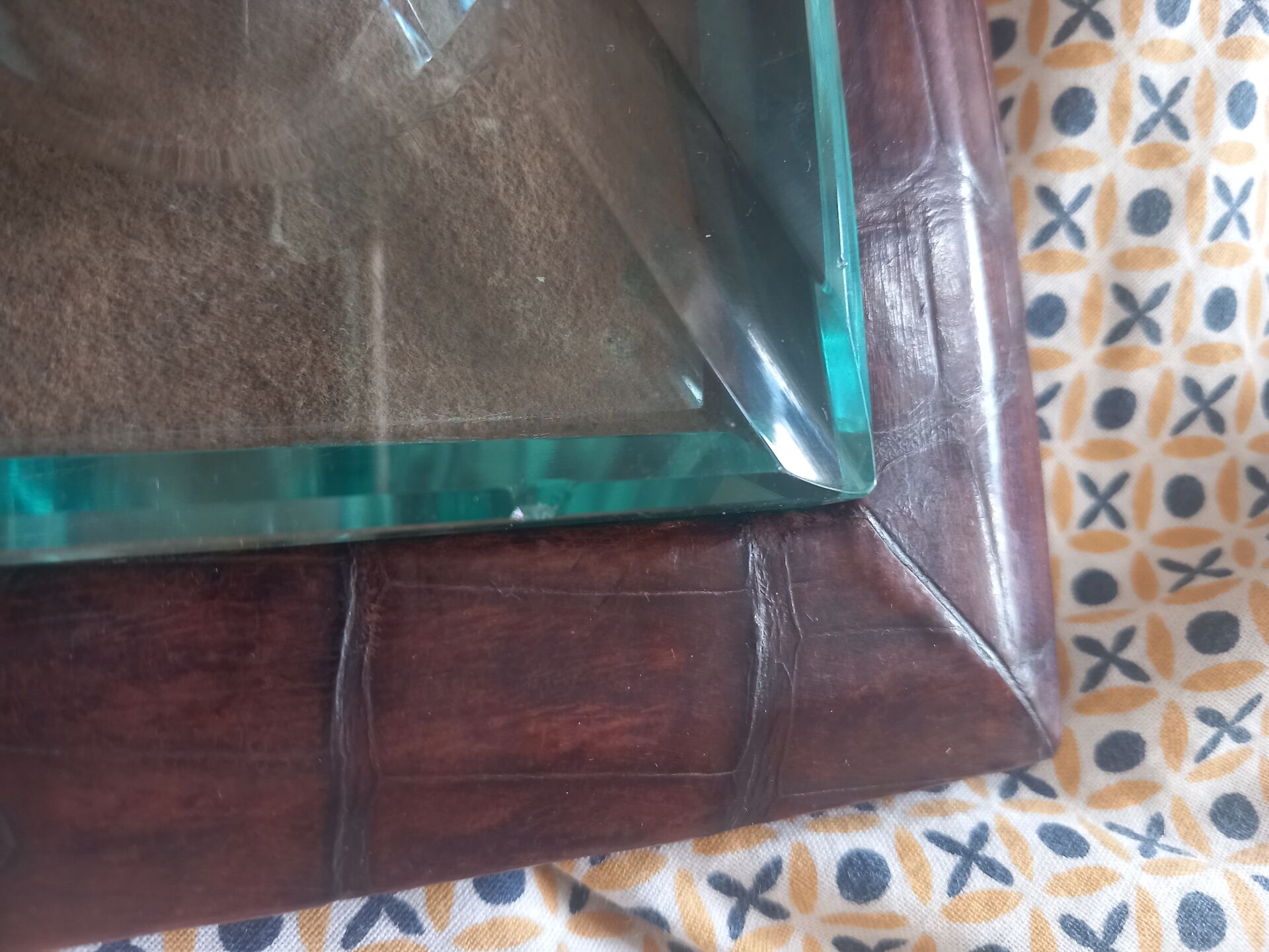 Crocodile leather ashtray with cut crystal.