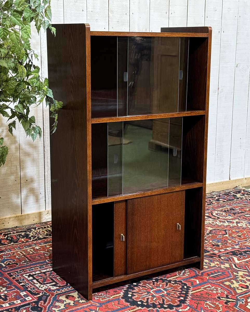 Small English oak library from the 1960s with sliding doors.