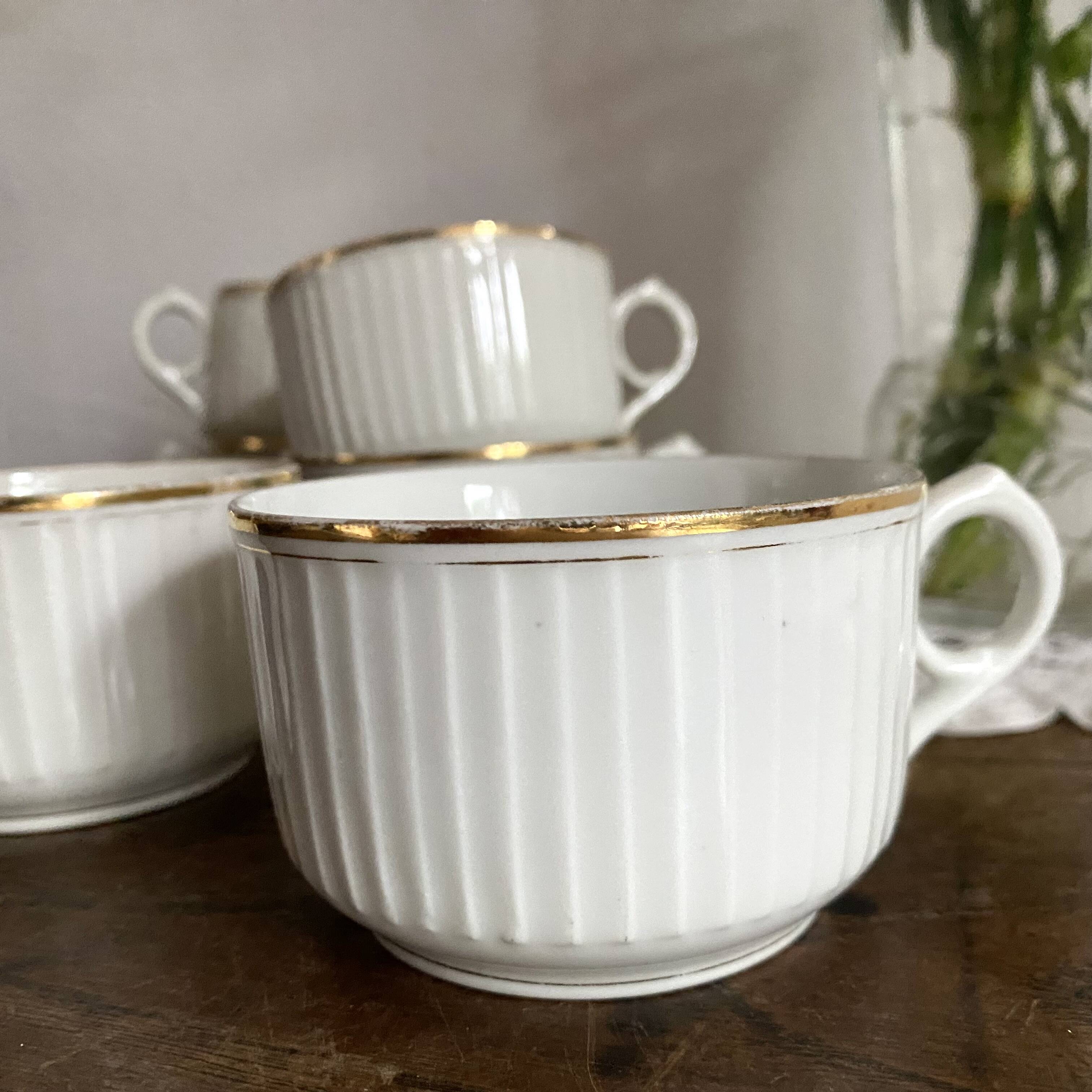 White and gold porcelain cups