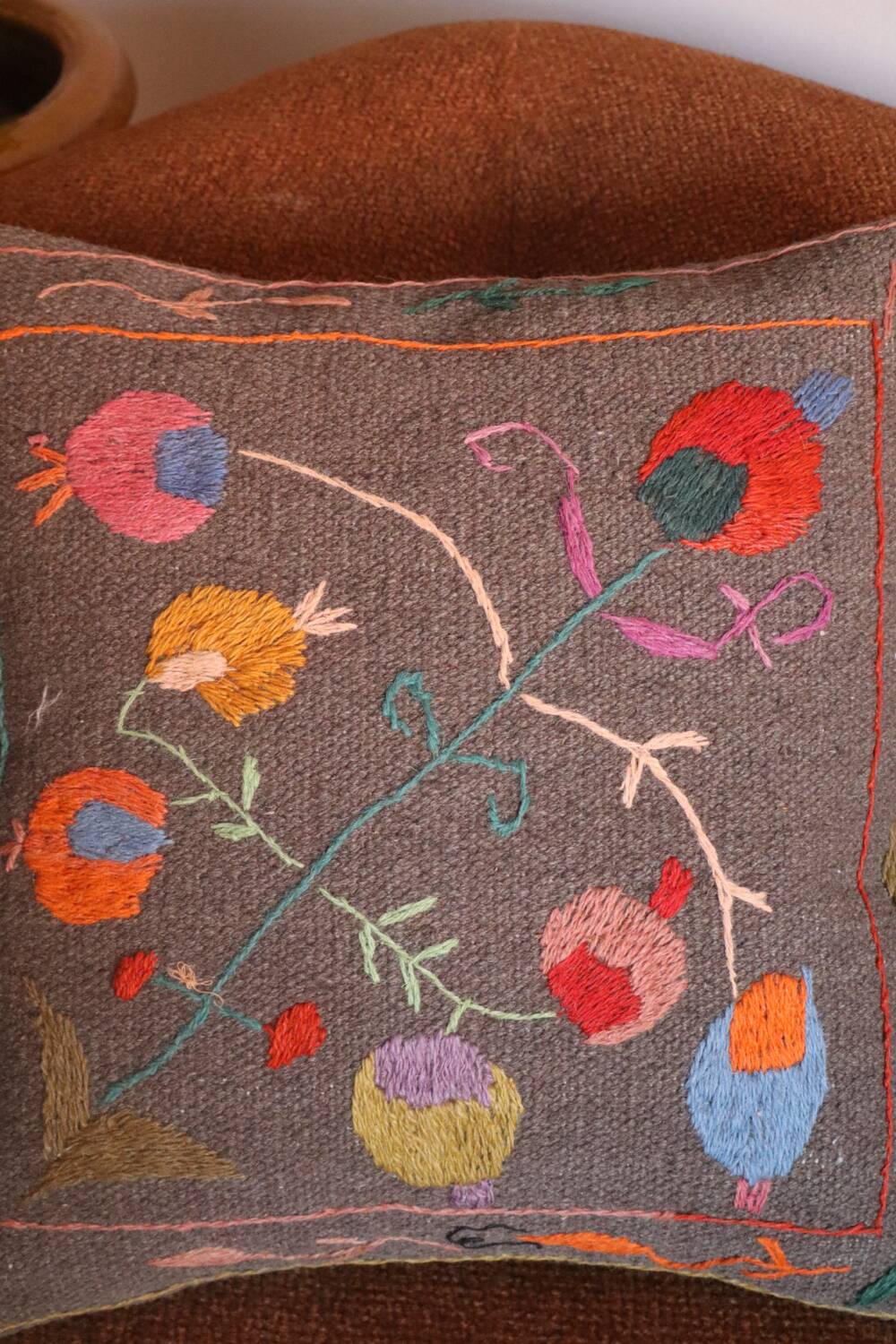 Colorful Suzani cushion in handmade embroidered wool