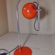 Eyeball space age orange desk or bedside lamp on an arc base